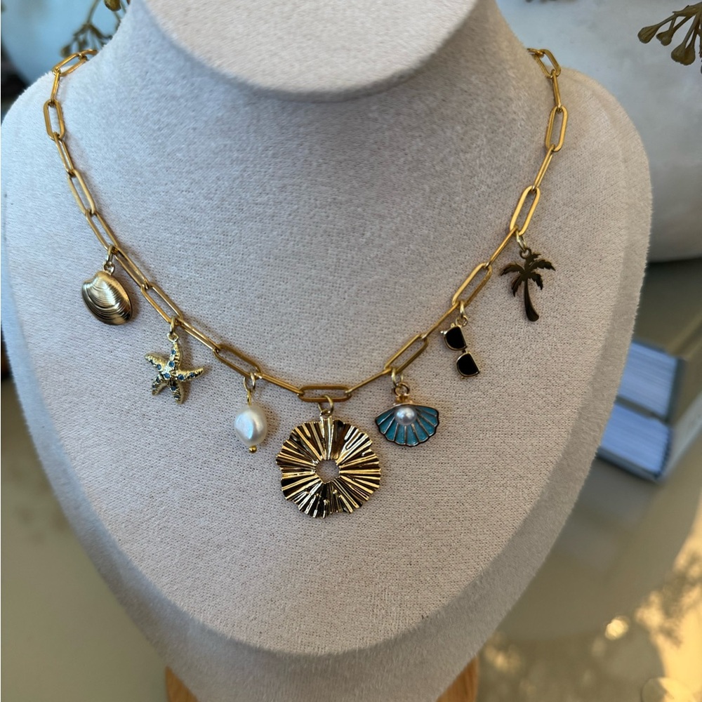 Gold Charm Necklace with Blue and Pearl Accents
